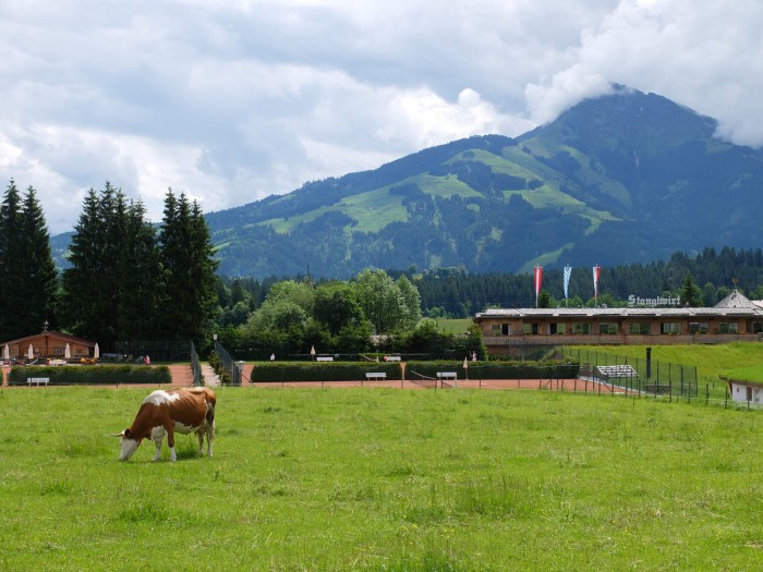 Pastures, tennis courts, and the new expansion of Stanglwirt, with the Kaiser mountains